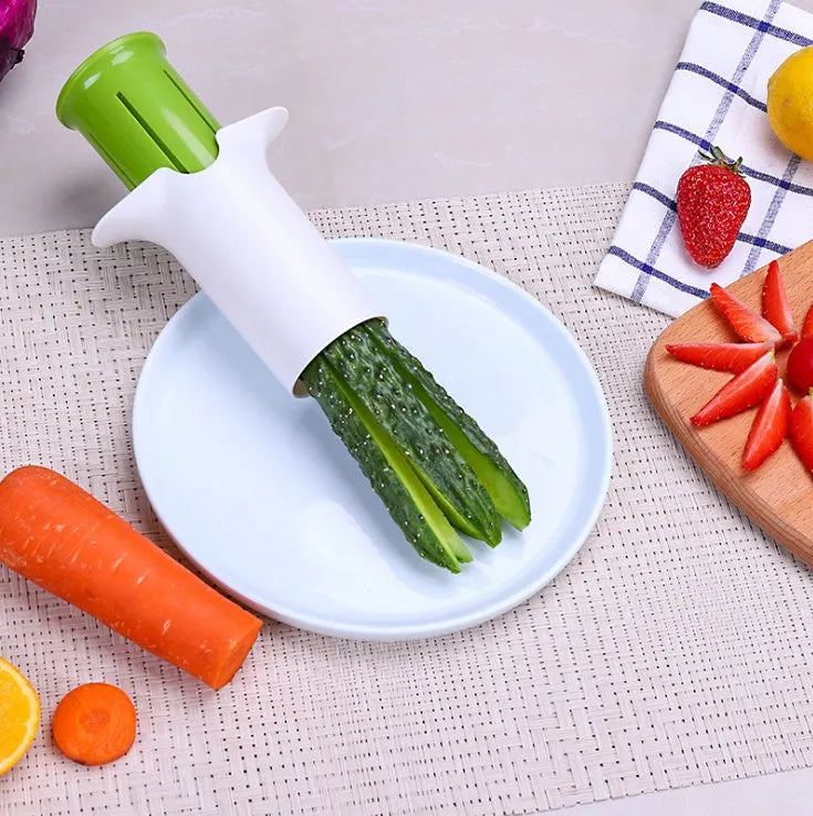 White kitchen vegetable and fruit slicer with multiple stainless steel blades.