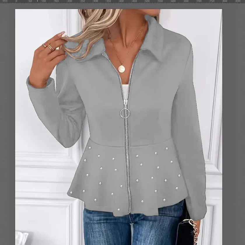 Women's black loose fit coat with a heavy-duty beaded zipper and a ruffled hem.