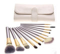 Persian make-up brush set with white synthetic bristles and champagne-colour handles in a case