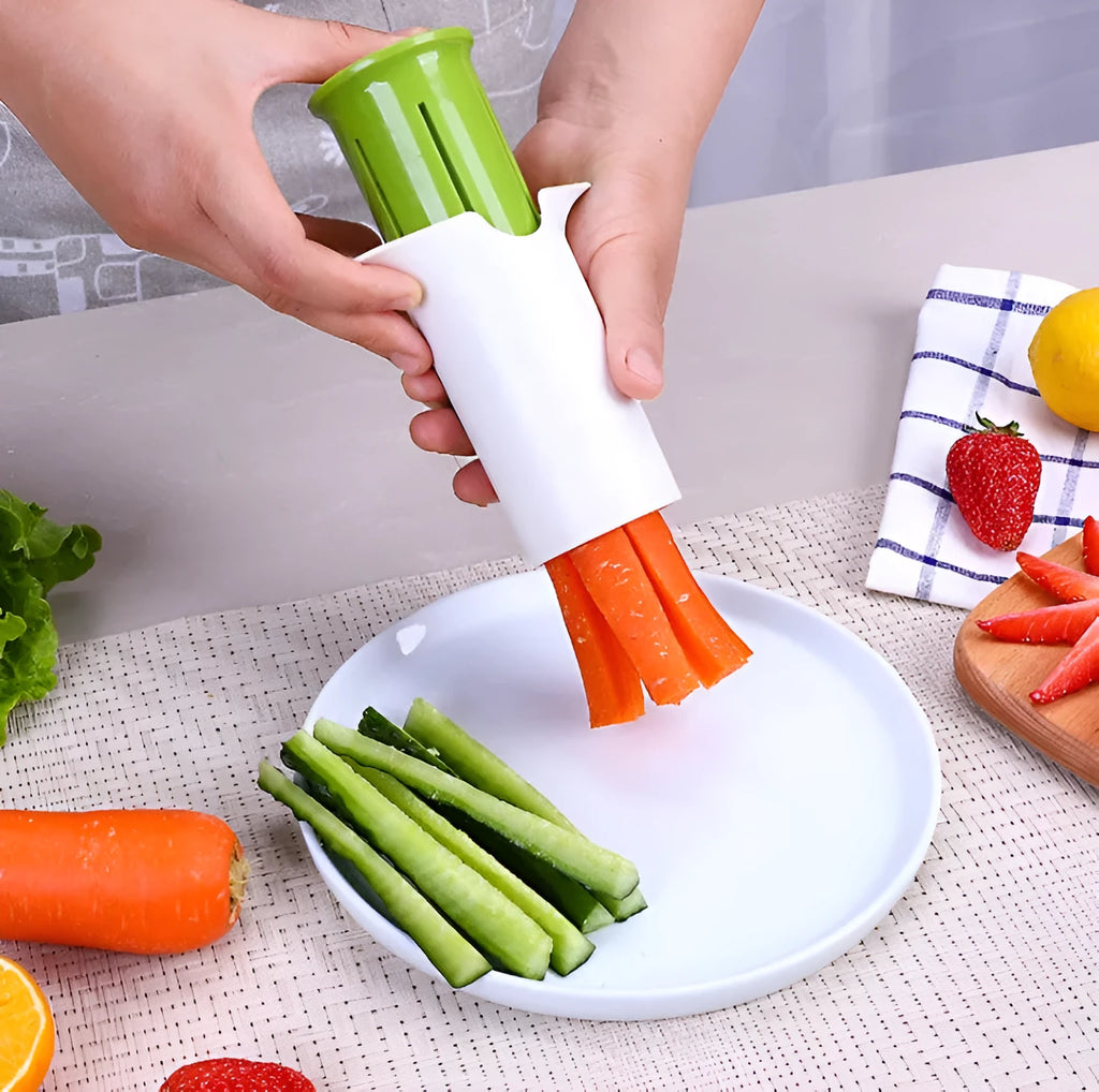 White kitchen vegetable and fruit slicer with multiple stainless steel blades.
