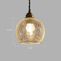 Brass and glass ball chandelier with spherical shade and metallic body
