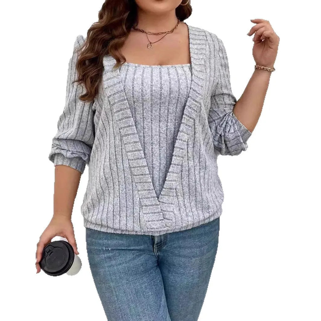 Women's solid colour ribbed false two-piece suit dress with V-neck and long sleeves.