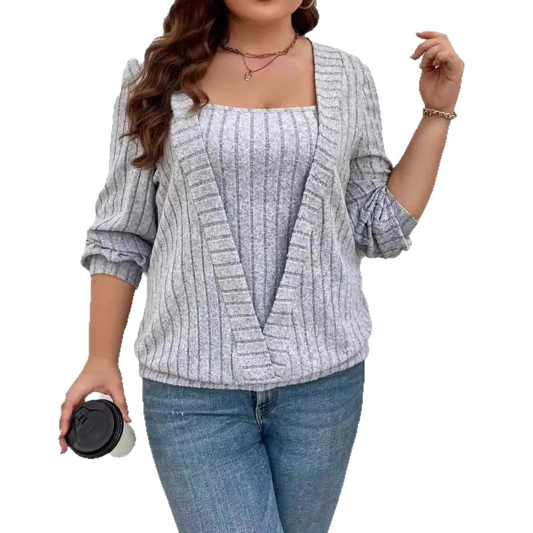 Women's solid colour ribbed false two-piece suit dress with V-neck and long sleeves.