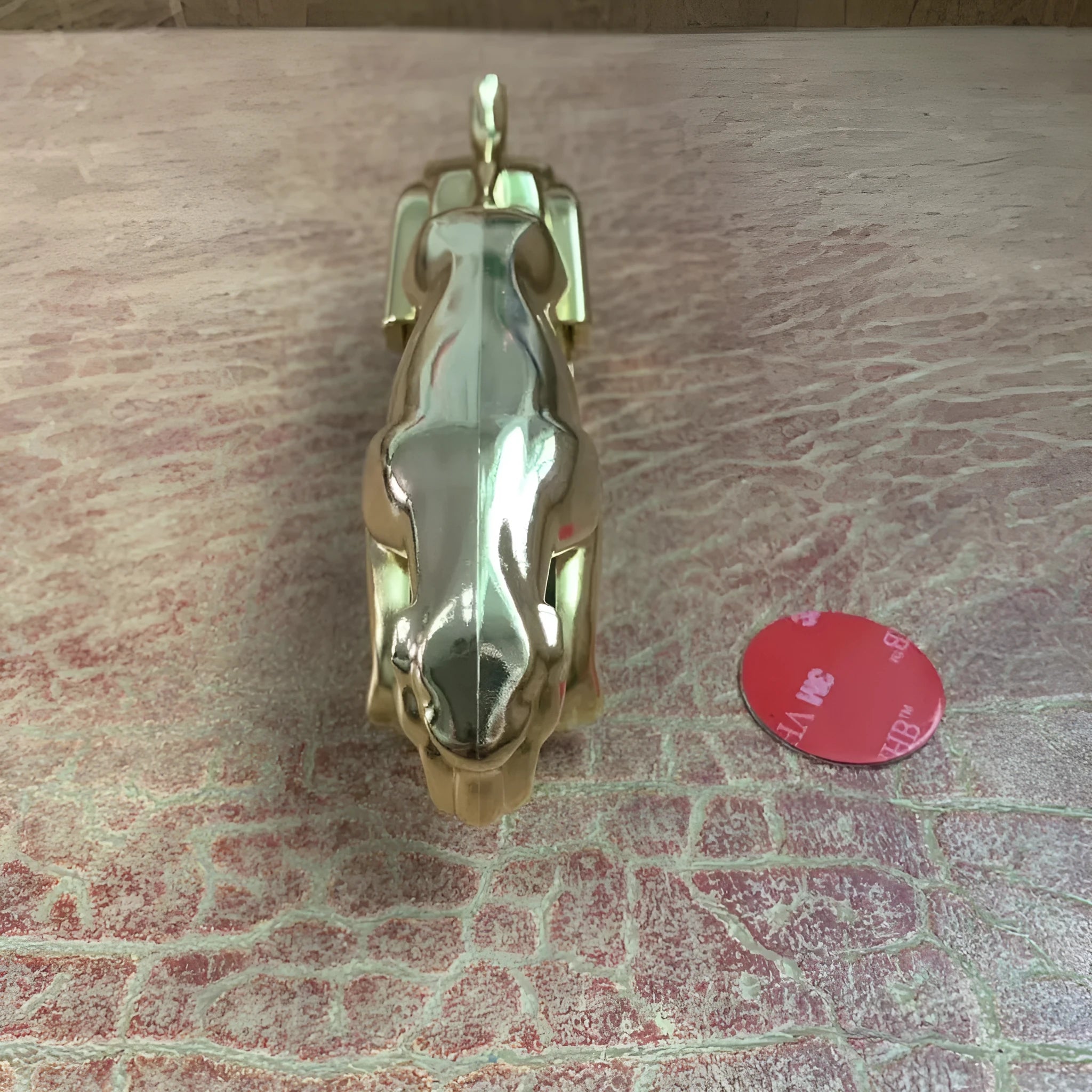 Rotatable car mobile phone holder in black, gold, and silver finishes made from ABS plastic.