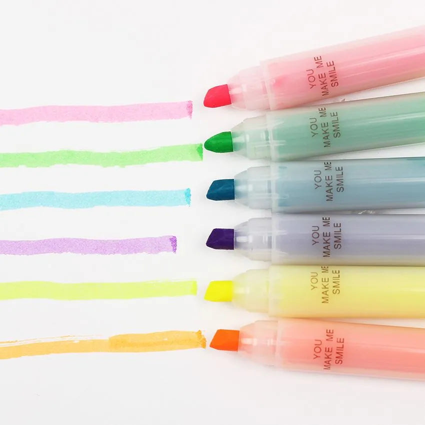 Set of six plastic highlighter pens with oblique tips in different colours for text marking