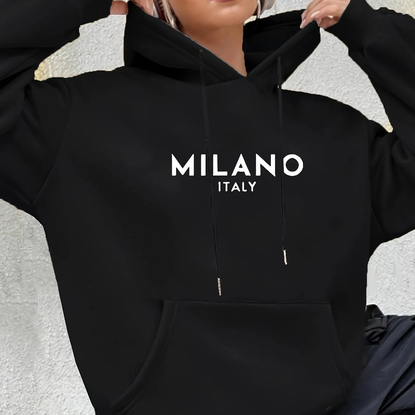Casual long sleeved printed kangaroo pocket hoodie in black, loose fit, front view