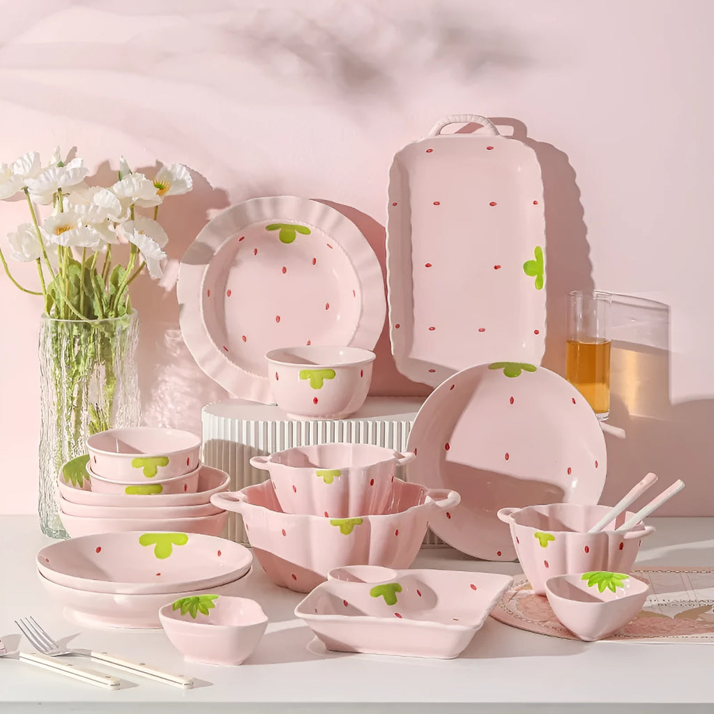 Strawberry design porcelain dinnerware set with plates, bowls, and twist spoon