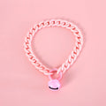 Macaron candy colour plastic collar for pet dog cat rabbit on a blue background.
