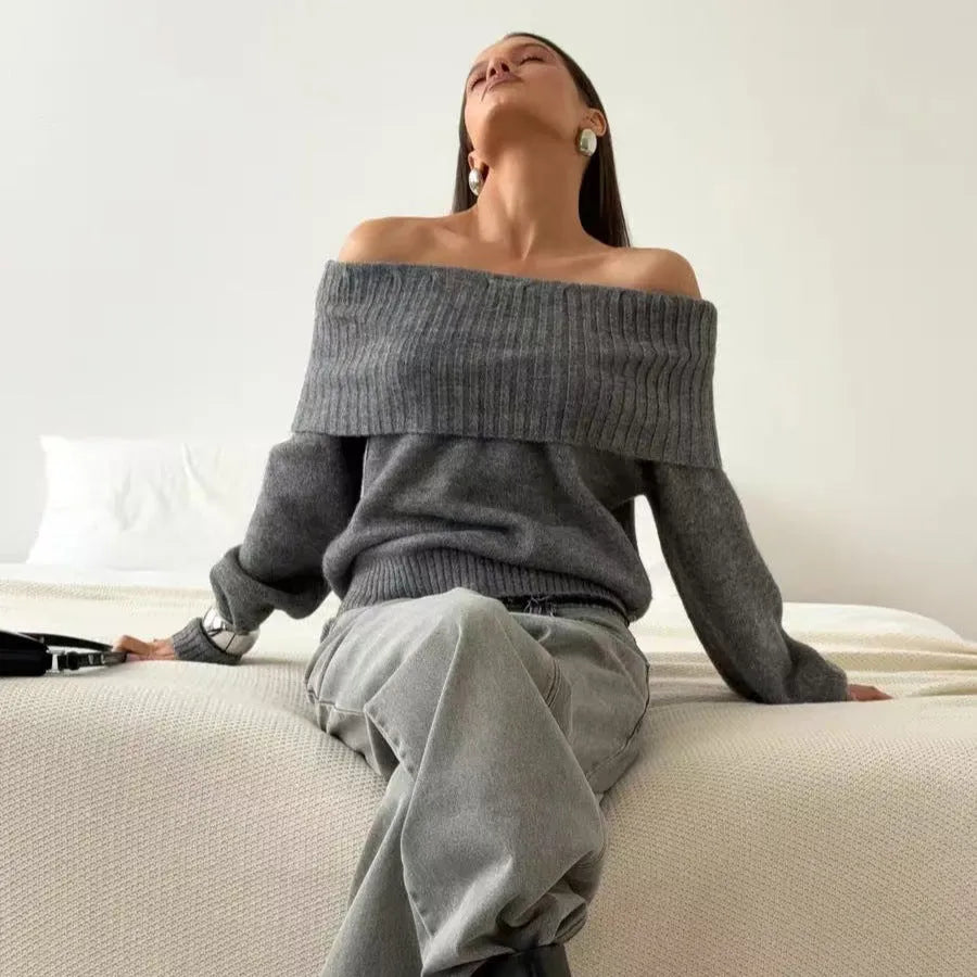 Grey off-the-shoulder pullover sweater with a textured 3D pattern on the front.