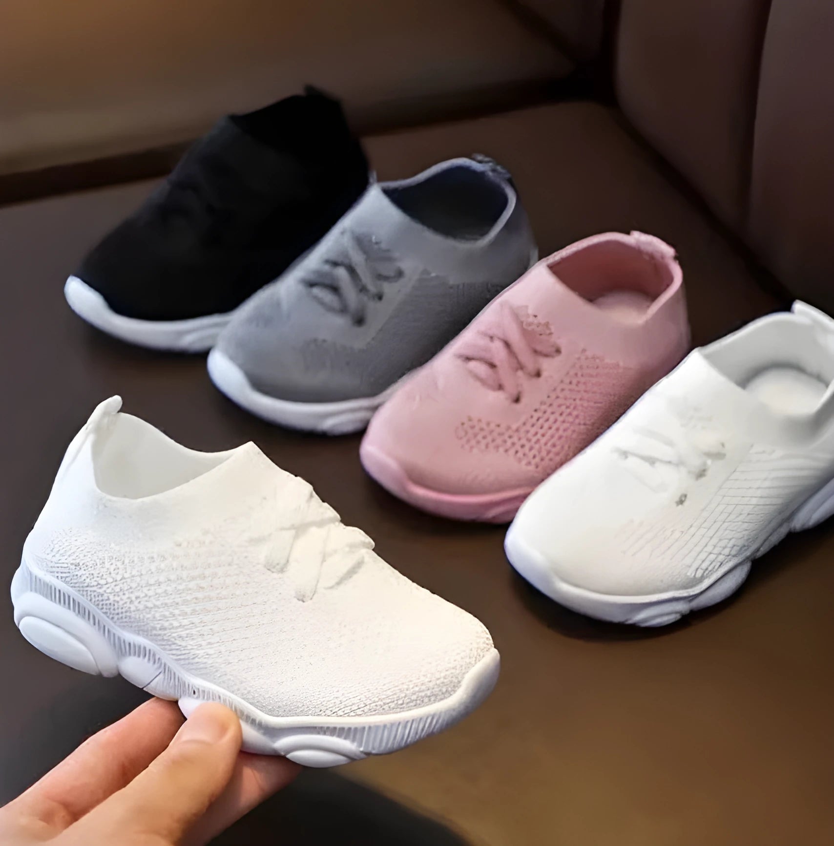 Children's fabric lazy shoes in white, black, pink, and grey colours with non-slip rubber sole