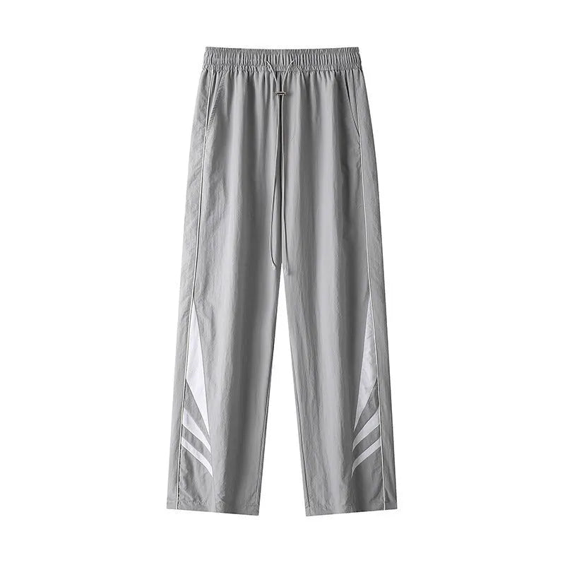 Men's straight-leg trousers in black or grey, featuring an elastic waist and loose fit.