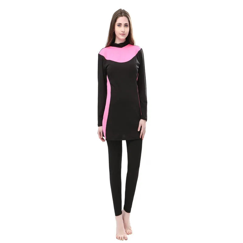 Women's black long sleeve hooded swimsuit top and pants set for swimming.