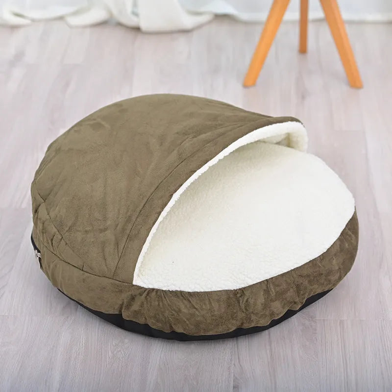 Brown cloth dog kennel with removable washable cover, shown on a wooden floor.