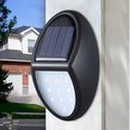 Black LED solar wall light with solar panel showing 75mm x 120mm dimensions