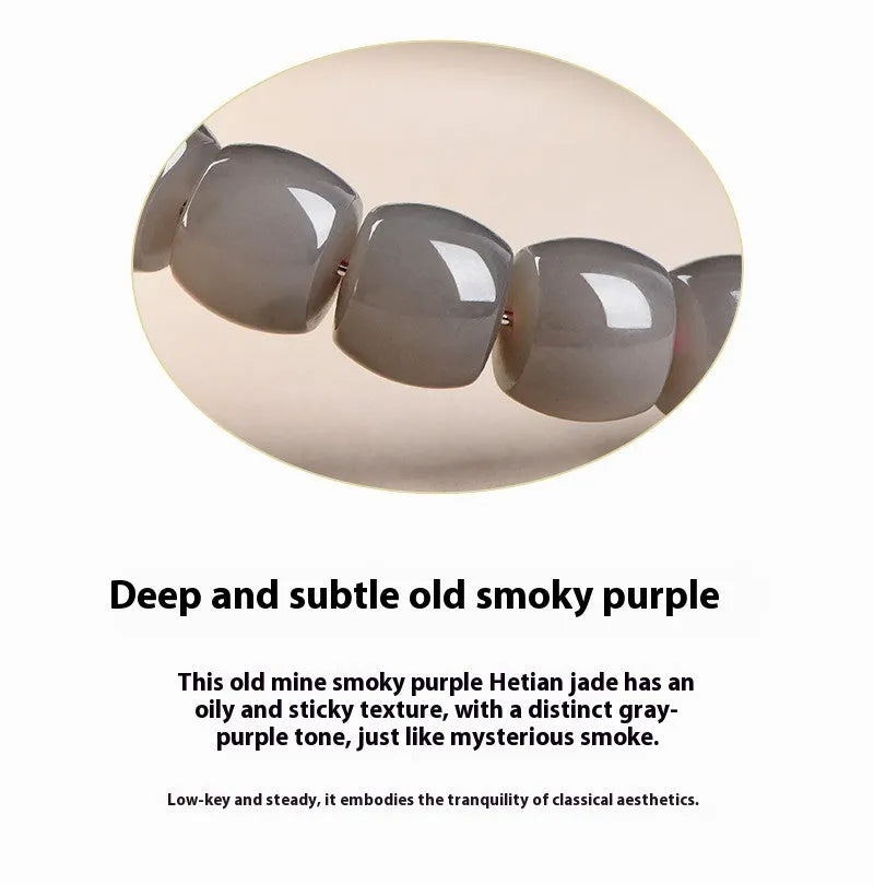 Natural smokey violet Hetian jade straight cut bracelet with 8x9mm beads on a wrist.