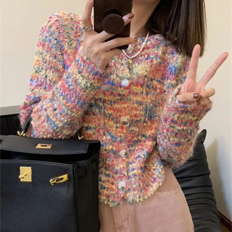 Rainbow pattern knitted cardigan in pink and green colours with toothbrush hair texture