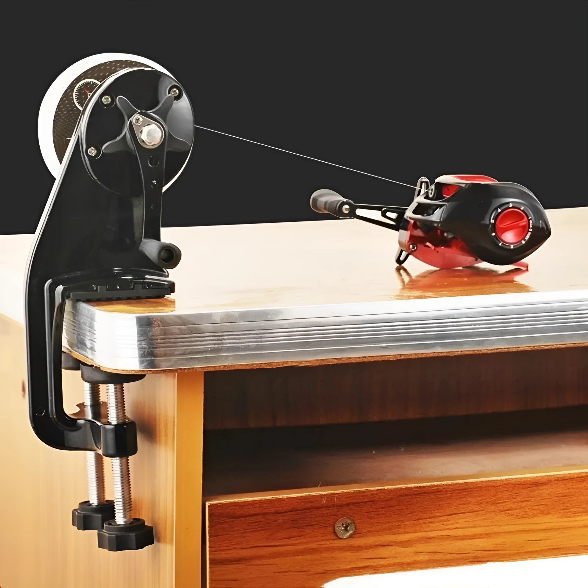 Portable fishing line winder with composite fibre construction and extension shaft