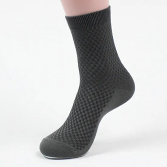 A pair of men's bamboo fibre socks in a classic colour, showing the small square pattern and medium thickness.