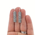 Silver geometric long earrings with carved vine design in retro style