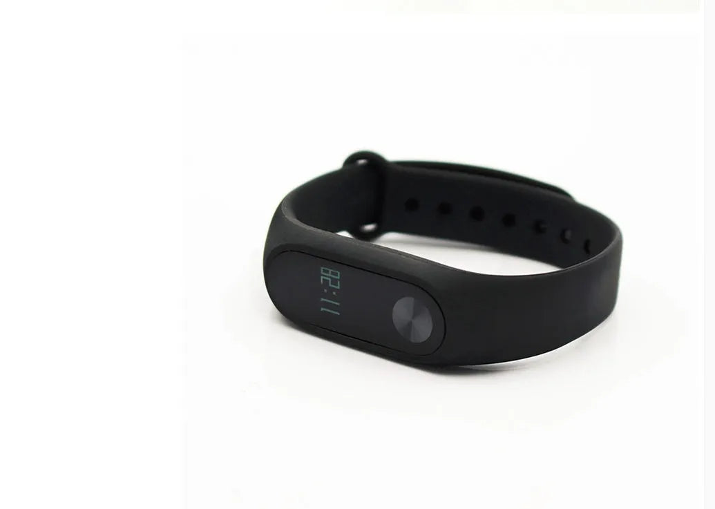 Xiaomi Mi Band 2 black smartband with OLED display on adjustable grey wrist strap.