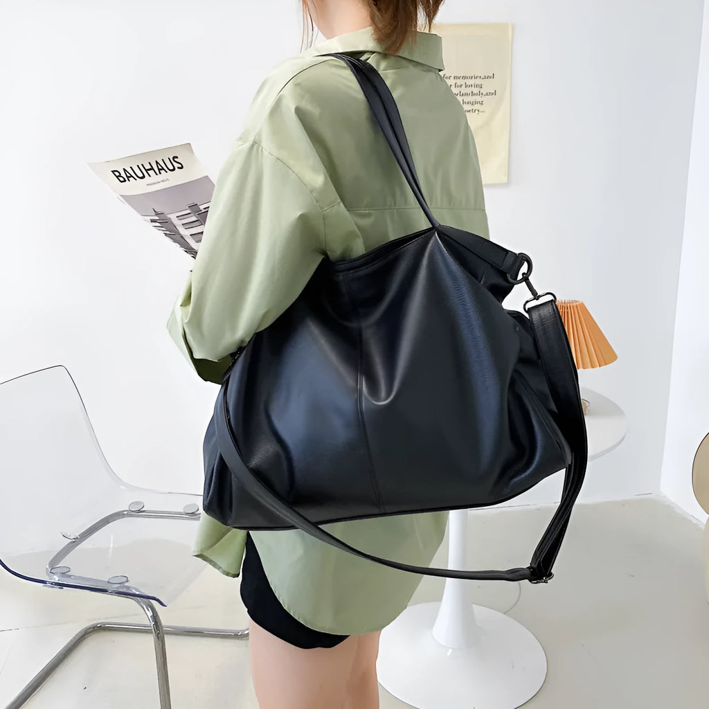 Large soft-surface PU messenger tote bag in black with zipper opening and adjustable shoulder strap