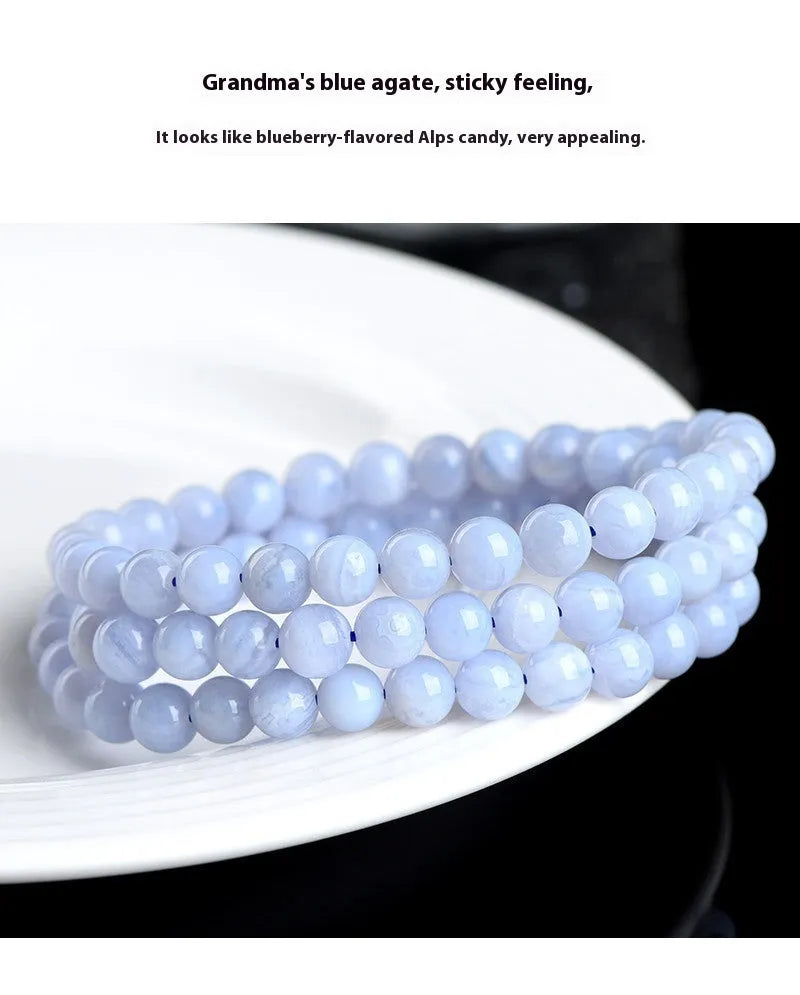 Natural blue agate bracelet with multi-circle pattern and a Ruyi charm.