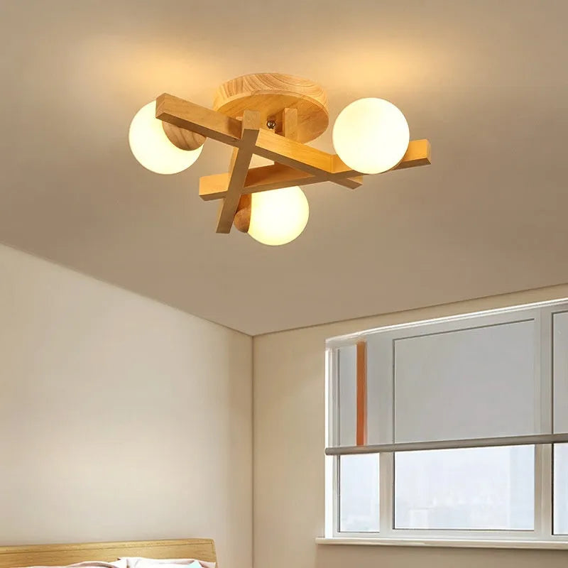 Wooden style modern Nordic ceiling light with three neutral light heads.