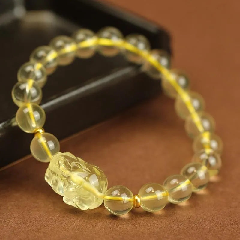 Yellow artificial crystal Pi Xiu bracelet with leather strap in Chinese national style.