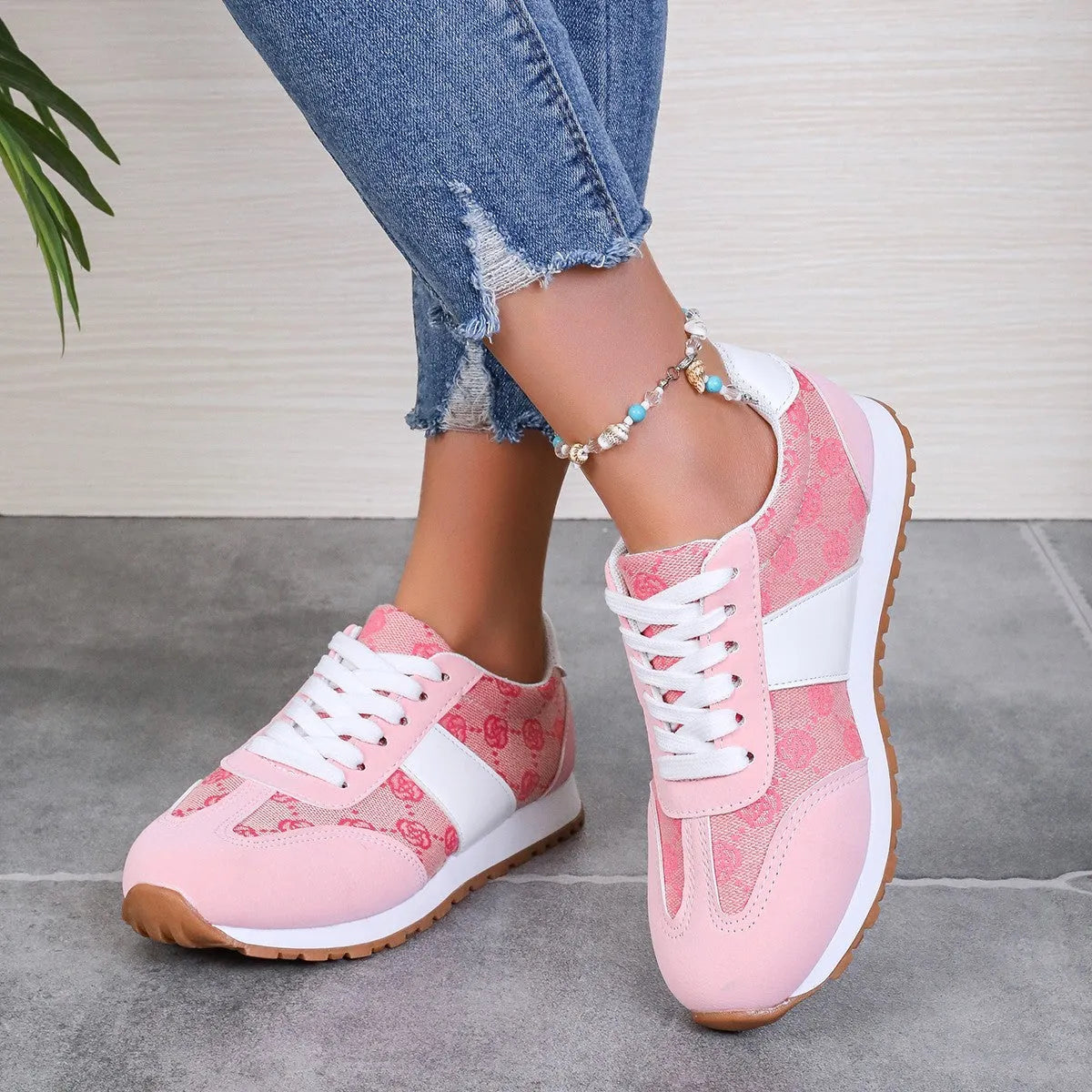 Women's oversized casual lace-up shoes with floral design in khaki colour showing round toe and cross-strap detailing