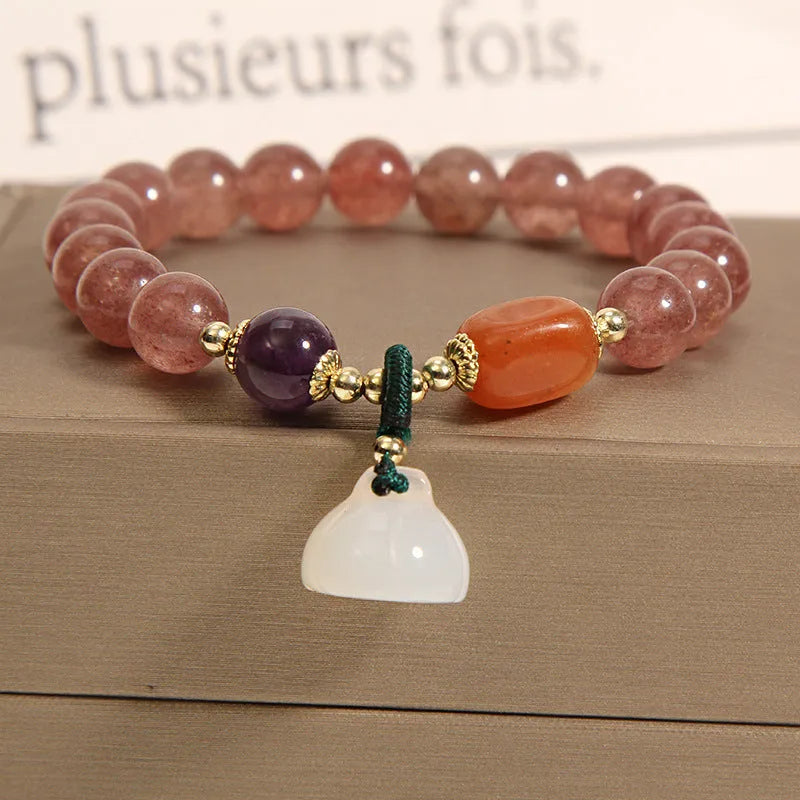 Women's multi-layer crystal bracelet with natural garnet, strawberry quartz pendants, and jinsi jade beads in assorted colours.