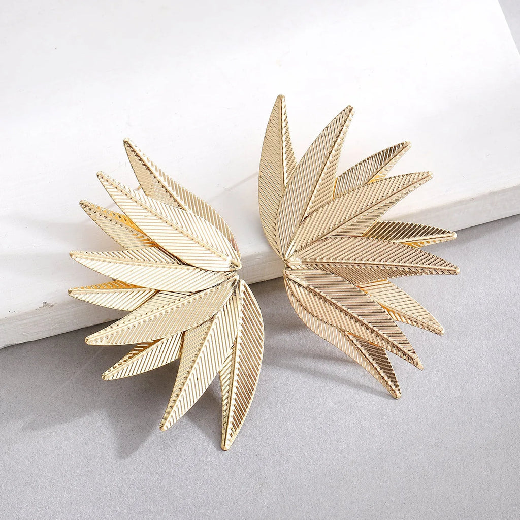 Leaf-shaped patch earrings in gold or white alloy with stud back closure
