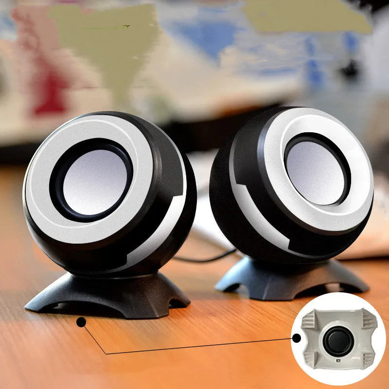 Pair of compact desktop speakers with USB cable and 3.5mm audio connection