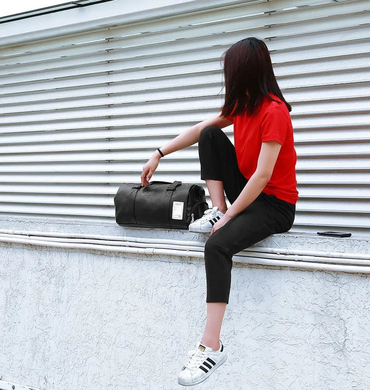 Black waterproof sports fitness bag with a separate shoe compartment, shown in two size options.
