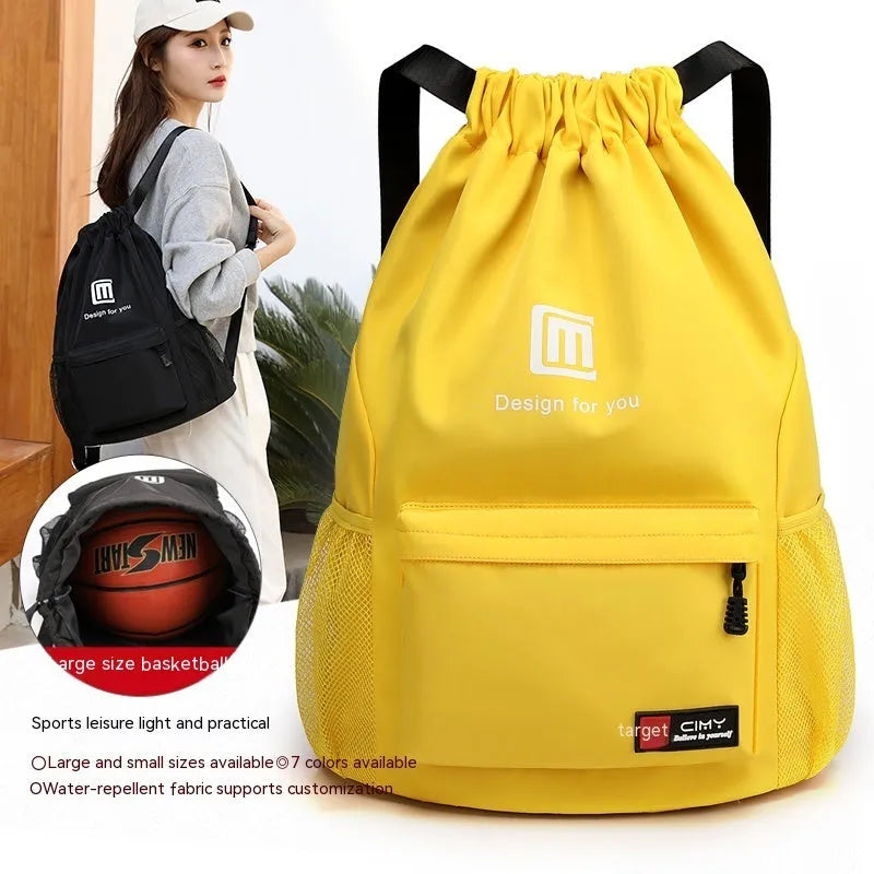 Oxford fabric drawstring travel backpack in grey, shown with double shoulder straps and bucket shape.
