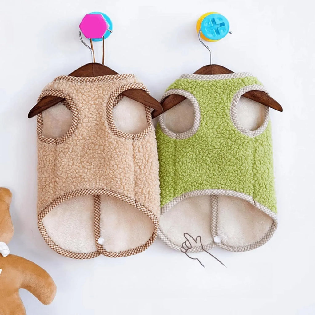 Green coral fleece dog vest with a leash ring on a small dog, showing the sleeveless design.