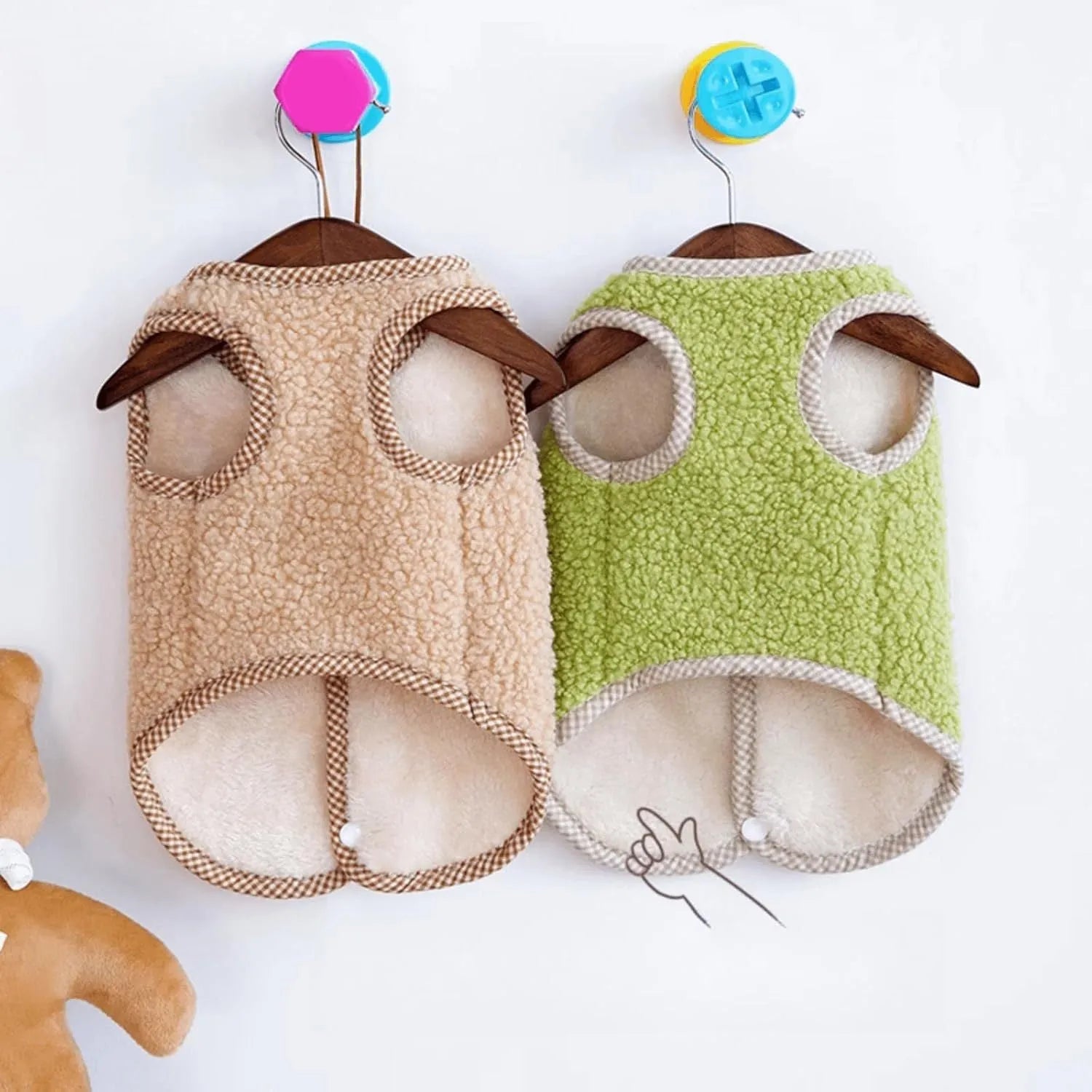 Green coral fleece dog vest with a leash ring on a small dog, showing the sleeveless design.