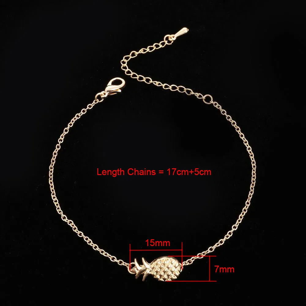 Women's gold tone alloy bracelet with a detailed pineapple charm on an adjustable chain.