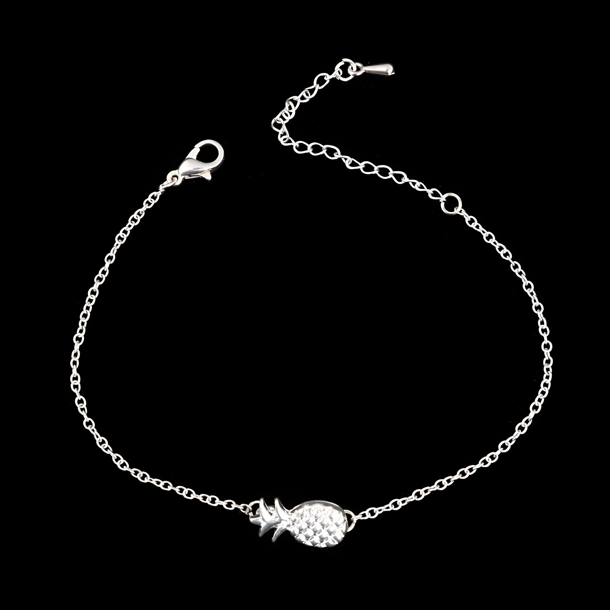 Women's gold tone alloy bracelet with a detailed pineapple charm on an adjustable chain.