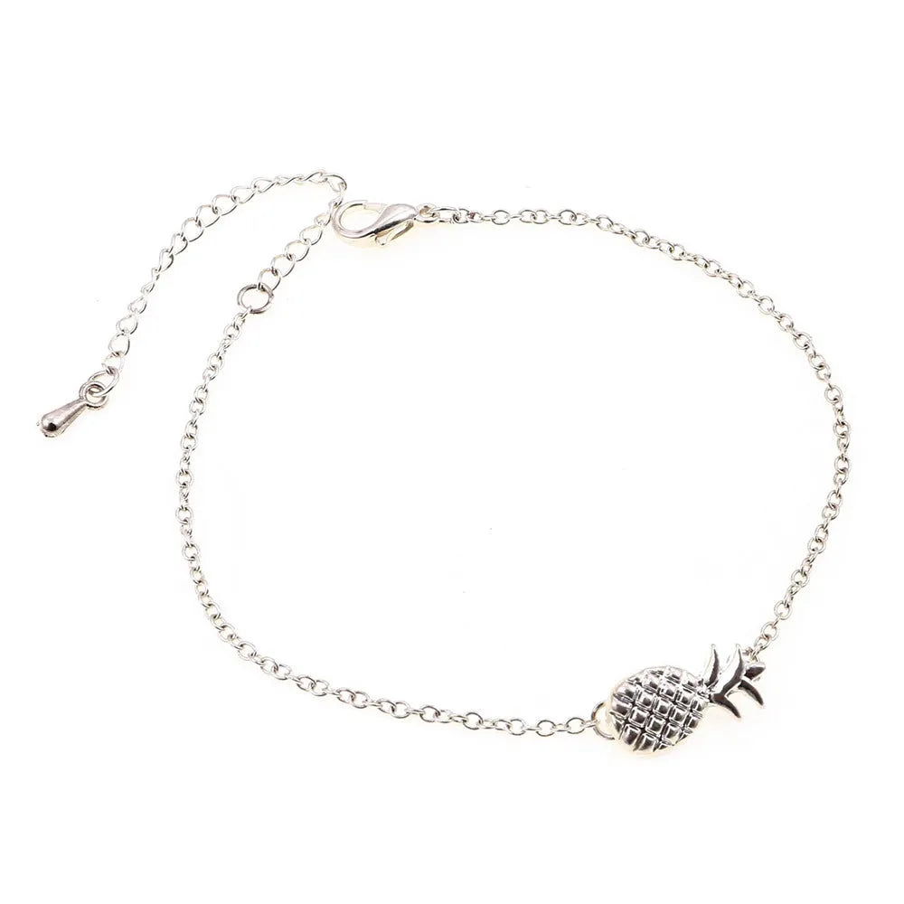 Women's gold tone alloy bracelet with a detailed pineapple charm on an adjustable chain.