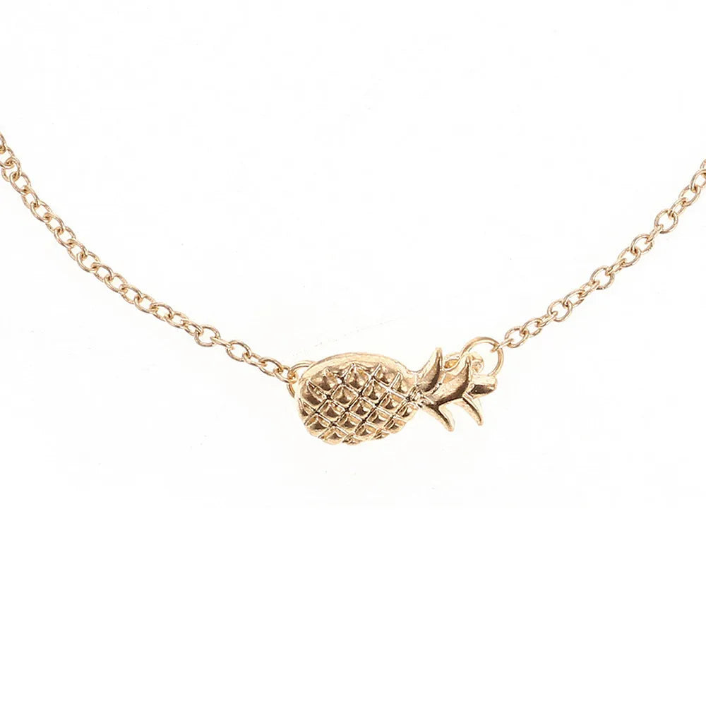 Women's gold tone alloy bracelet with a detailed pineapple charm on an adjustable chain.