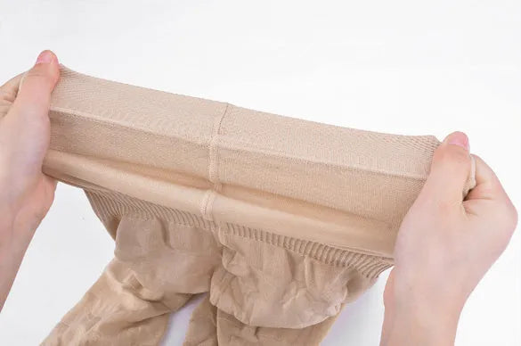 Women's black seamless high waist shapewear shorts laid flat on a white background.