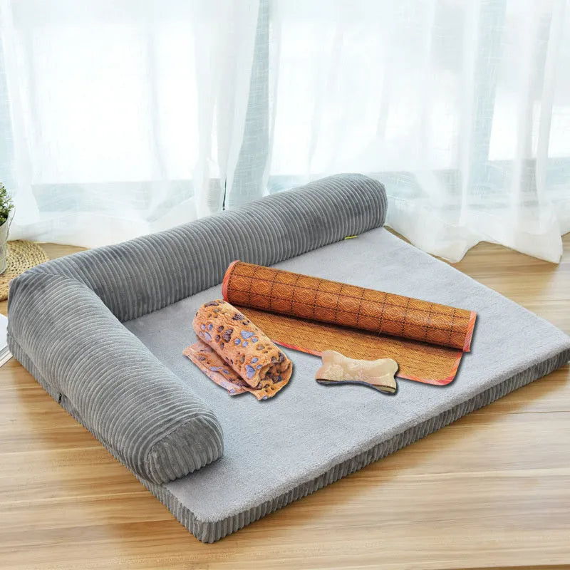 Corduroy bolster dog bed in grey with a removable cover, shown in a large (L) size on a hardwood floor.