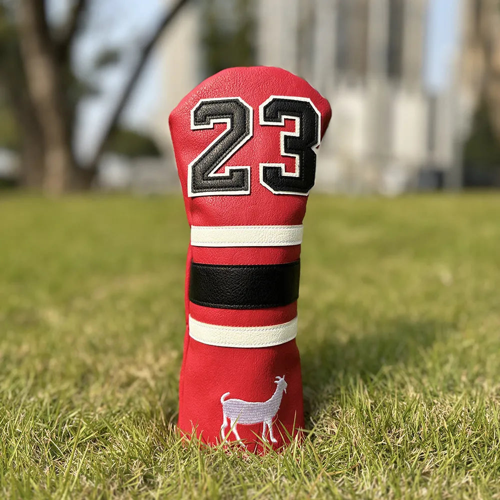 Set of coloured chicken drumstick design golf club head covers for fairway woods, a square putter, and irons.