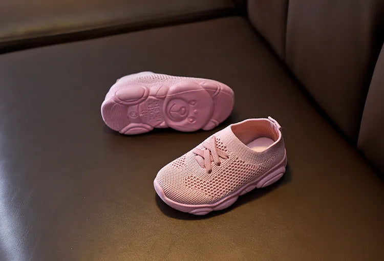 Children's fabric lazy shoes in white, black, pink, and grey colours with non-slip rubber sole