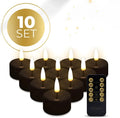 Four black S10 LED tealight candles showing flickering warm white light