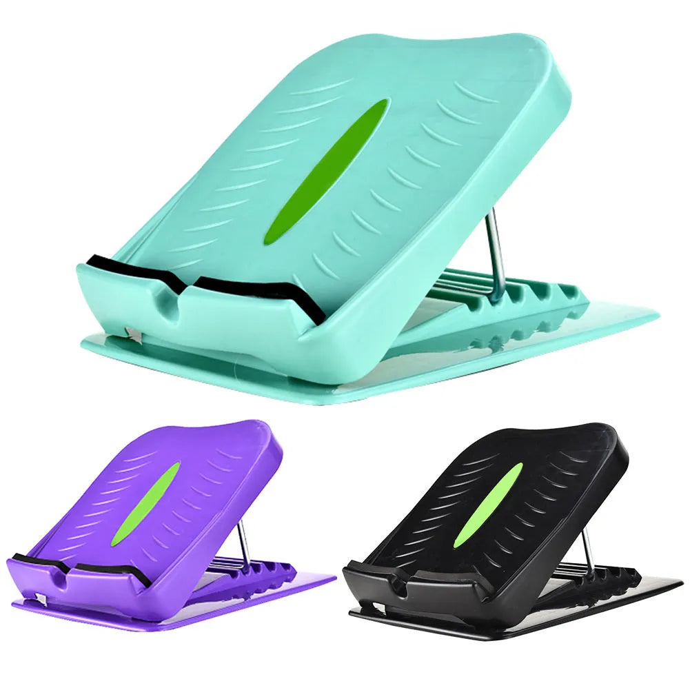 Portable black ABS calf stretching board with four adjustable incline positions on a textured surface