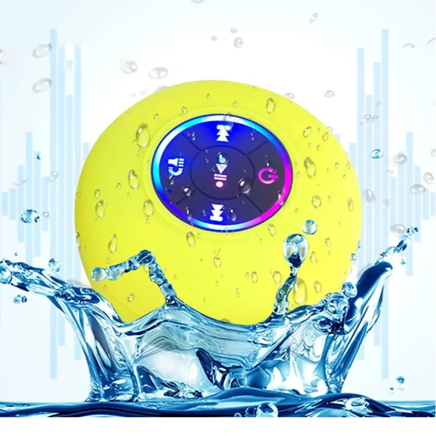 Large white waterproof Bluetooth speaker with a suction cup base and built-in LED light