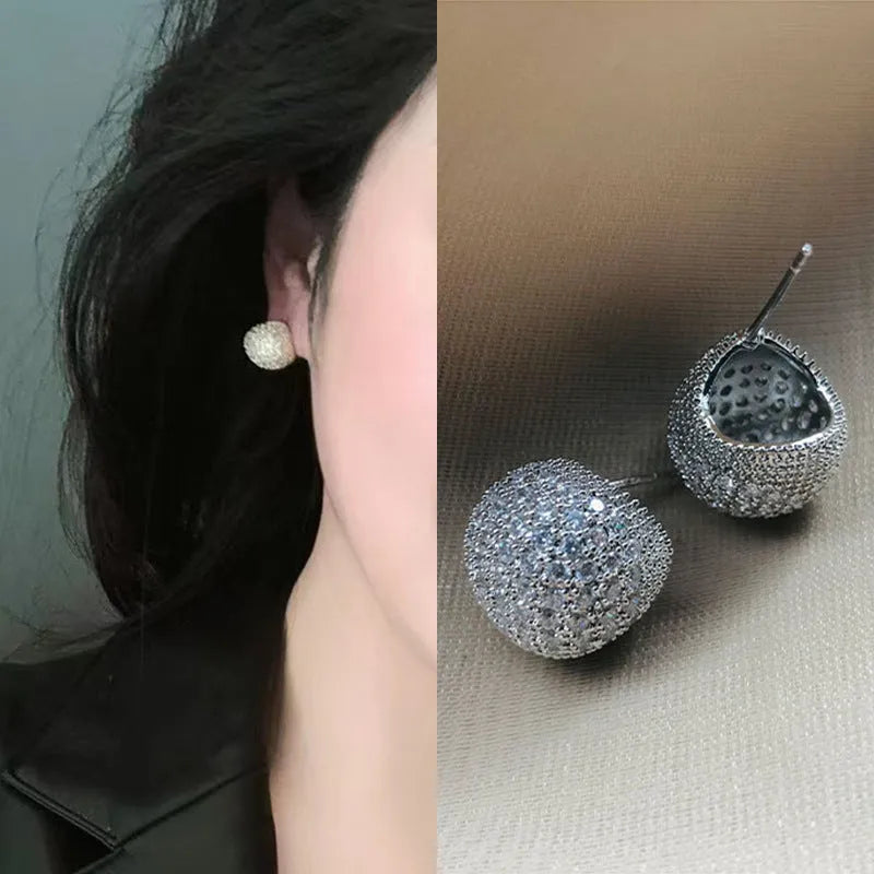 Golden beans shaped clip earrings with diamond crystals in drop geometric design