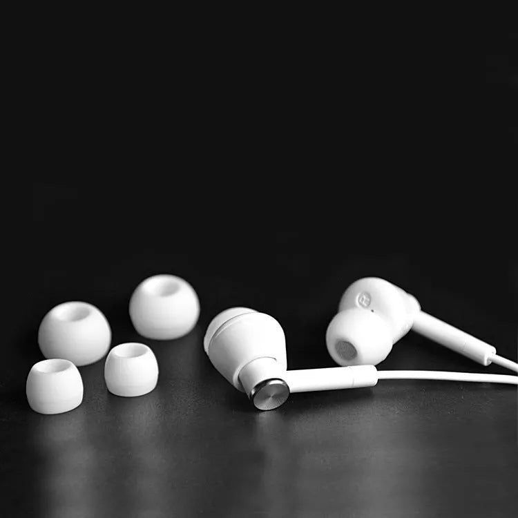 Black and white wired in-ear earphones with subwoofer for computers and mobile phones
