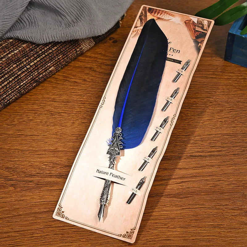 Retro zinc alloy feather dip pen in choice of ten colours on a desk.